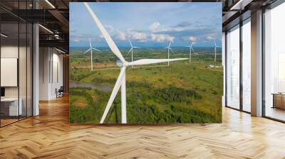 Aerial view of wind turbines or windmills farm field in industry factory. Power, sustainable green clean energy, and environment concept. Nature innovation. Wall mural