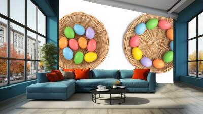 Colorful easter eggs on a basket and white background. Food decoration on holiday. Wall mural