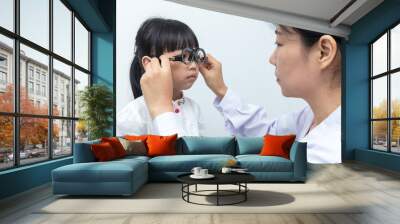 Asian Little Chinese Girl Doing Eyes Examination by ophthalmologist Wall mural