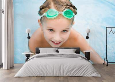 Cute little girl in swimming poo Wall mural