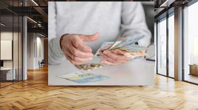 Elderly Woman'S Hands Count Money, Euros, In Close-Up View Wall mural