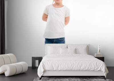 girl in t-shirt standing isolated on white background Wall mural