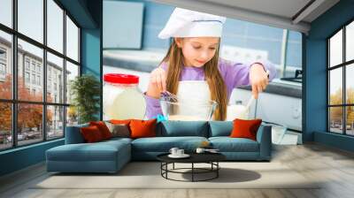 little girl preparing cookies Wall mural