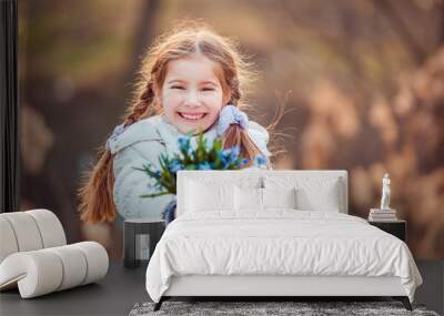 little girl with a snowdrops Wall mural