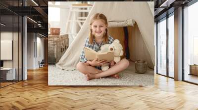 Nice little girl with paper book Wall mural