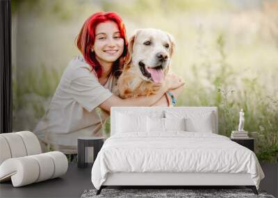 Teen girl with golden retriever dog Wall mural