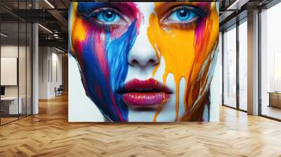 A Close-up of a Woman's Face Covered in Vibrant, Abstract Paint, Creating a Bold and Artistic Expression Wall mural