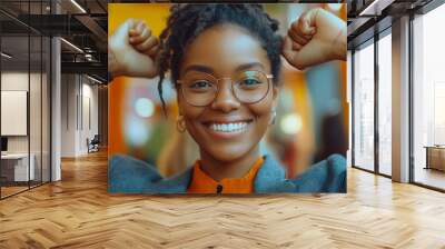 A woman with glasses and a smile on her face Wall mural