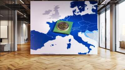 2 euro coin over a CPU on an European Union map, symbolizing the Digital Euro. European and the national central banks of the euro area are exploring the benefits and risks of a digital coin. Wall mural