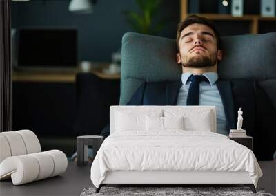 Relaxed businessman resting in modern office chair, focused ambiance. Wall mural