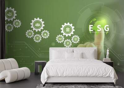 Businessman touching ESG icon on virtual screen for environmental, social, and governance in sustainable and ethical business on a technology green background.	 Wall mural