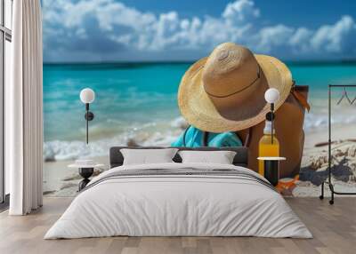 A beach bag filled with summer essentials like sunscreen, hat, and towel Wall mural