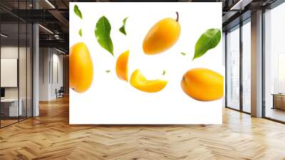 Mango with half slices falling or floating in the air with green leaves isolated on background, Fresh organic fruit with high vitamins and minerals. Wall mural