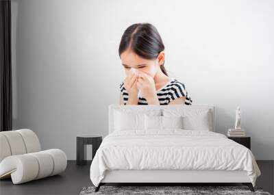 Little asian kid girl with allergy sneezing Wall mural