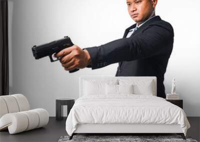 Portrait of a pottrade, a gunman wearing a black suit and holding a pistol isolated included with clipping path. Wall mural