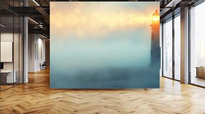 A serene lighthouse emerges from the fog, casting a guiding light over a tranquil ocean at dawn. Wall mural