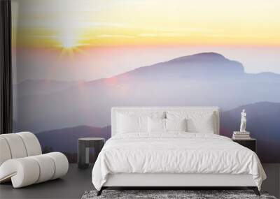 Wonderful sunrise over the mountain peak. Wall mural