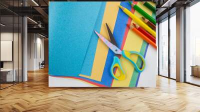  of kids scissors colored paper and pencils Wall mural