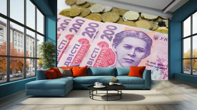 200 hryvnia and coins on a white background. Business concept. Wall mural