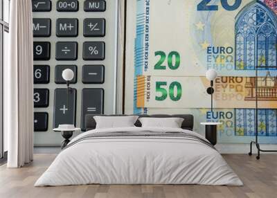 euro banknotes and calculator on white background Wall mural