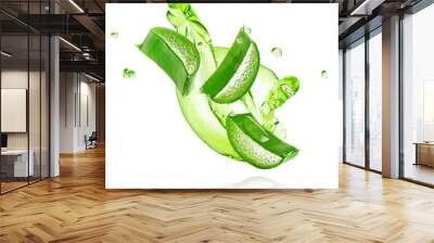 Green gel flowing with aloe vera slices isolated on white background with clipping path. Wall mural