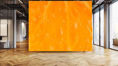 Macro shot of orange fruit texture. Food background Wall mural