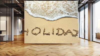 holiday written on the sand beach near sea Wall mural