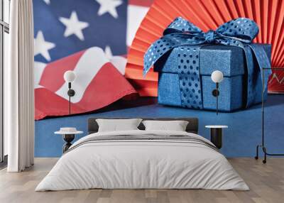 Blue Gift box against US American flag. Happy Independence Day. Stars and stripes. Copy space. memorial day Wall mural