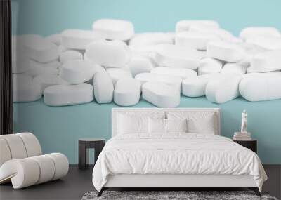 Medical banner of many white capsule tablets or pills on blue table. Close up. Healthcare pharmacy and medicine concept with copy space Painkillers or prescription drugs. pharmaceutical industry Wall mural