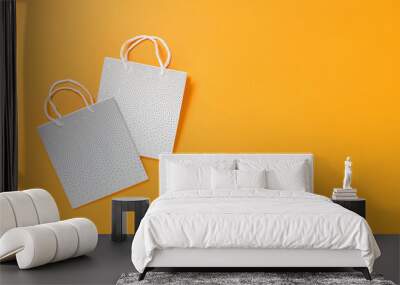 Two blank mockup white shopping bags on orange background. Shopping or sale concept banner with copy space. Minimal Wall mural