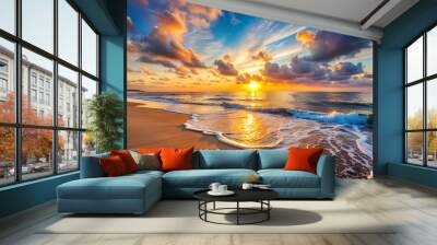 a beach with a wave that is coming in. Wall mural