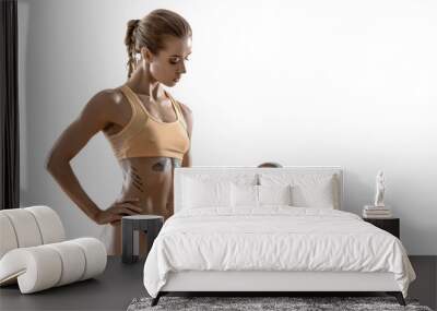 young fitness woman  with dumbbells Wall mural