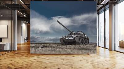 Military or army tank ready to attack moving over a deserted battle field terrain Wall mural