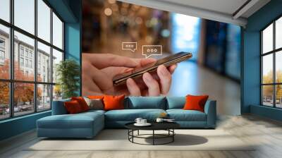 Online communication and social media content marketing concept. Man hand using mobile smartphone and receive notification icons of message comment. Wall mural