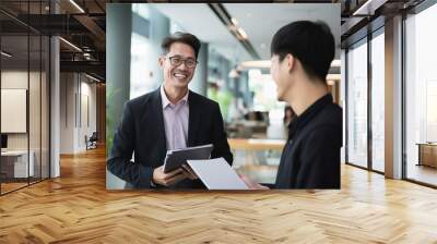 asian man having a business meeting and smiling Wall mural