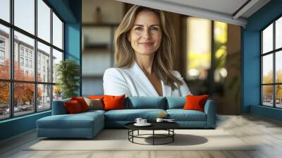 A confident, smiling middle-aged businesswoman attorney stands in her office. The 45-year-old entrepreneur and executive manager exudes professionalism and leadership in this portrait. Wall mural