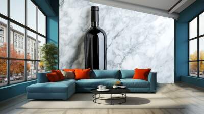 A black wine bottle on a white marble surface Wall mural