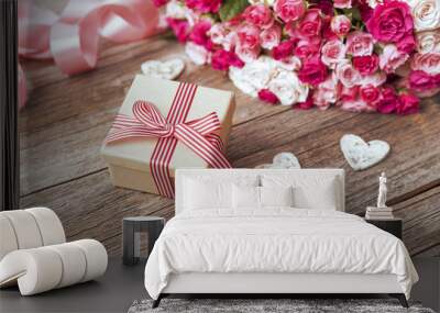 Gift box and bunch of roses. Wall mural