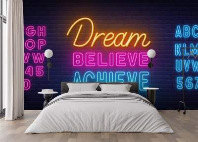 Dream Believe Achieve neon lettering on brick wall background Wall mural