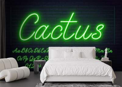 Neon green script font. Glowing alphabet with letters, numbers and special characters on a brick background. Wall mural