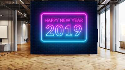 Neon sign happy new year on a dark background with bright alphabets. Wall mural