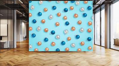 Christmas baubles. Blue, golden and silver balls on blue background Wall mural