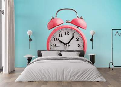 Red alarm clock on blue background Wall mural