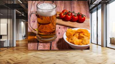 Beer on the table with chips and tomatoes Wall mural