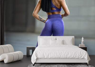 Girl with perfect butt posing in leggings Wall mural