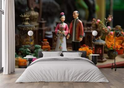 Chinese wedding in miniature style. Husband and wife in traditional Chinese clothes. Concept of love, tradition, family and relationships. Asian man and woman created with Generative AI Technology Wall mural