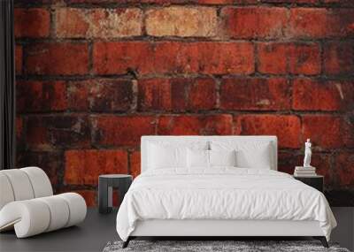 Close-up view of a worn and aged textured red brick wall with rustic appearance and subtle shadows Wall mural