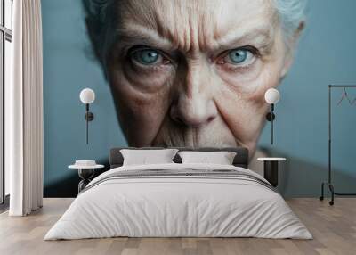 Minimalistic portrait of an angry elderly woman with sharp features against a gray background highlighting her intense expression Wall mural