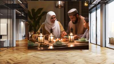 Muslim family at the dining table during ramadan Wall mural