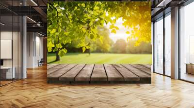 Spring summer beautiful natural background with green foliage in sunlight and empty wooden table outdoors. Abstract backgrounds wallpaper. Ai generative Wall mural